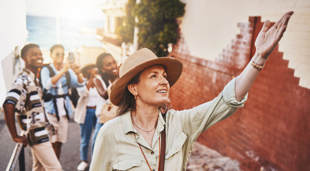 A women leading guided tours with The Corley Group Travel